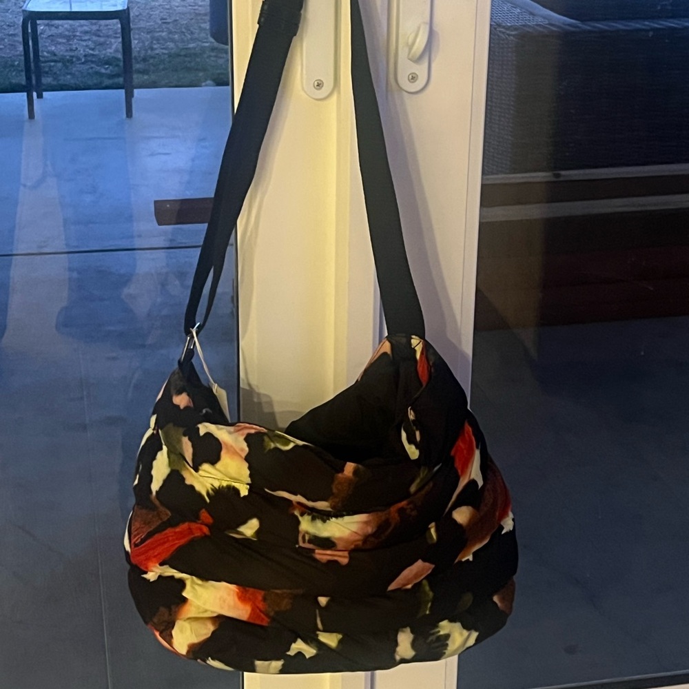 Ted Baker duffle bag. It is designed for woman & made in polyester & Nylon
